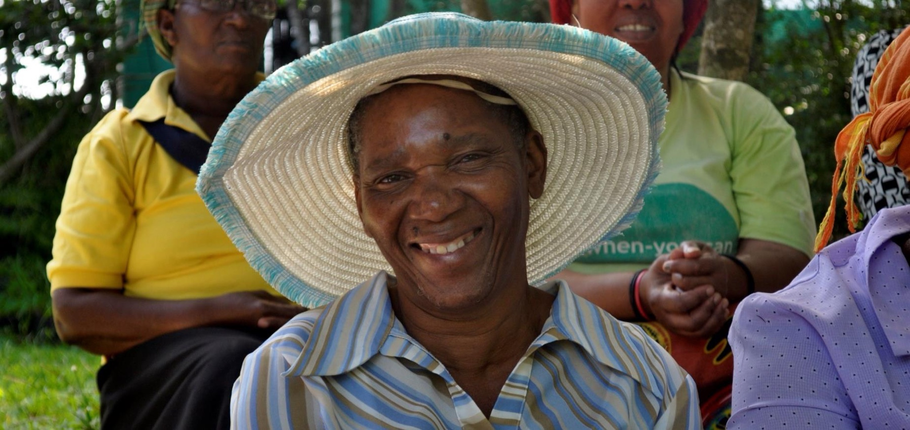 A participant photographed on the ACT report spread documenting the Dukuduku and Phumlani training programmes
